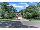 Beautiful home featuring a two-car garage, lawn and surrounding mature trees at 111 Ferncroft Ct, Cary, NC 27519