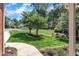 Well-maintained front yard featuring a lush green lawn, decorative trees and ornamental plants at 111 Ferncroft Ct, Cary, NC 27519