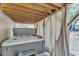 Backyard covered hot tub with privacy curtains, ideal for relaxation at 111 Ferncroft Ct, Cary, NC 27519