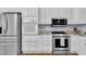 Updated kitchen features stainless appliances and granite counters at 111 Ferncroft Ct, Cary, NC 27519