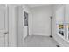 Small laundry closet with a washer and dryer in room with light wood floors and large window at 111 Ferncroft Ct, Cary, NC 27519