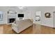 Inviting living room featuring hardwood floors, fireplace and access to bedroom at 111 Ferncroft Ct, Cary, NC 27519