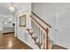 Interior view featuring a carpeted staircase with white risers and stained railing at 111 Ferncroft Ct, Cary, NC 27519