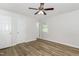 Bedroom featuring ceiling fan, wood flooring, and white doors, perfect for relaxation at 1110 Allgood St, Durham, NC 27704