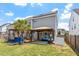 Home featuring a backyard with a patio, bar, and solar panels at 1161 Tulip Poplar Rd, Fuquay Varina, NC 27526