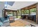 Backyard patio area with grill, seating, and shade covering at 1161 Tulip Poplar Rd, Fuquay Varina, NC 27526