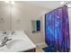 Bathroom featuring double sink vanity, with a shower and stylish galaxy-themed shower curtain at 1161 Tulip Poplar Rd, Fuquay Varina, NC 27526
