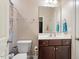 Bathroom featuring a wood vanity, tile flooring, and a shower with a curtain at 1161 Tulip Poplar Rd, Fuquay Varina, NC 27526