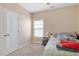 Bedroom featuring neutral paint, carpet flooring, a window, and a double door closet at 1161 Tulip Poplar Rd, Fuquay Varina, NC 27526