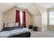 Bedroom with a ceiling fan, sloped ceilings, neutral paint, and a small bed with storage at 1161 Tulip Poplar Rd, Fuquay Varina, NC 27526
