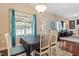 Dining area with views of the backyard, seamlessly connecting to the living room, enhancing the open layout at 1161 Tulip Poplar Rd, Fuquay Varina, NC 27526