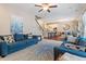 Inviting living room featuring plush sofas, a stylish rug, and an open layout to the kitchen and dining area at 1161 Tulip Poplar Rd, Fuquay Varina, NC 27526