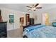 Main bedroom featuring a ceiling fan, ensuite, and an array of stylish decor at 1161 Tulip Poplar Rd, Fuquay Varina, NC 27526