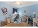 Bright office space with pastel blue walls, modern desk, and an array of shelving at 1161 Tulip Poplar Rd, Fuquay Varina, NC 27526