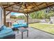 Backyard patio featuring stylish furniture and covered seating area at 1161 Tulip Poplar Rd, Fuquay Varina, NC 27526