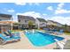 Backyard pool with lounge chairs and sunny backyard seating areas at 1161 Tulip Poplar Rd, Fuquay Varina, NC 27526
