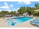 Backyard pool with blue tiled floors and plenty of lounge seating at 1161 Tulip Poplar Rd, Fuquay Varina, NC 27526