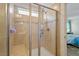 Tiled shower with glass door features a tiled bench and built in storage at 1161 Tulip Poplar Rd, Fuquay Varina, NC 27526