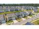 Expansive aerial view showcasing a well-planned neighborhood with neatly arranged homes and manicured lawns under a clear blue sky at 1177 Sun Springs Rd, Wake Forest, NC 27587