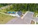 Aerial view showcasing community amenities, including tennis courts, a clubhouse, ample parking, and landscaped grounds at 1177 Sun Springs Rd, Wake Forest, NC 27587