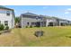 Landscaped backyard with a screened porch and green grass at 1177 Sun Springs Rd, Wake Forest, NC 27587