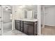 Bathroom with dual sink vanity, cabinets, and mirrors, leading to the bedroom and shower at 1177 Sun Springs Rd, Wake Forest, NC 27587