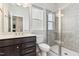 Modern bathroom features a stylish vanity, a tiled glass shower, and a window allowing natural light at 1177 Sun Springs Rd, Wake Forest, NC 27587
