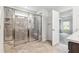 Bathroom showcasing a tiled glass shower and a doorway leading into the primary bedroom at 1177 Sun Springs Rd, Wake Forest, NC 27587