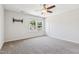 Bedroom with plush carpeting, a large bright window, and ceiling fan at 1177 Sun Springs Rd, Wake Forest, NC 27587