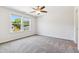 Bedroom with plush carpeting, ceiling fan, and a large bright window at 1177 Sun Springs Rd, Wake Forest, NC 27587