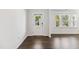 Bright entryway featuring wood flooring, a white door with glass, and a view of the outdoors at 1177 Sun Springs Rd, Wake Forest, NC 27587