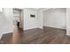 Open-concept living area with wood floors and access to the kitchen, perfect for entertaining at 1177 Sun Springs Rd, Wake Forest, NC 27587