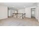 Carpeted upstairs loft with neutral walls, white railing, and multiple doorways leading to other rooms at 1177 Sun Springs Rd, Wake Forest, NC 27587