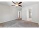 This bright main bedroom has carpet floors and an ensuite bathroom with a shower at 1177 Sun Springs Rd, Wake Forest, NC 27587