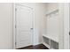Mudroom with white bench seating, coat hooks, and storage cubbies, providing an organized entry space at 1177 Sun Springs Rd, Wake Forest, NC 27587