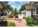 Backyard featuring a brick pathway, patio and view of the home's rear entrance at 119 Palace Grn, Cary, NC 27518
