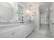 Bright bathroom featuring double vanity with marble countertops, undermount sinks, and framed mirrors at 119 Palace Grn, Cary, NC 27518