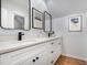 Bright bathroom featuring a double sink vanity with black hardware and framed mirrors at 119 Palace Grn, Cary, NC 27518