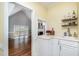 Butlers pantry with white cabinets, sink and bar area in this home at 119 Palace Grn, Cary, NC 27518