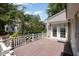Deck with white railings and a view of trees in the back yard at 119 Palace Grn, Cary, NC 27518
