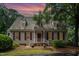 Charming home featuring a cedar shake roof, brick entryway, and well-maintained landscaping at 119 Palace Grn, Cary, NC 27518