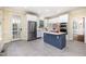 Spacious kitchen featuring stainless steel appliances, white cabinetry, and a blue island under recessed lighting at 119 Palace Grn, Cary, NC 27518