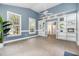 Living room featuring natural light, neutral colored walls, and built-in shelving at 119 Palace Grn, Cary, NC 27518