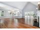 Empty living room featuring neutral colors, fireplace, high ceilings and hardwood floors at 119 Palace Grn, Cary, NC 27518