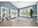 Sunroom featuring large windows, tiled floors, and direct access to the backyard at 119 Palace Grn, Cary, NC 27518