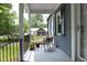 Inviting front porch with seating and potted plants, offering a relaxing outdoor space at 120 Pine St, Carrboro, NC 27510
