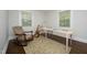 Bedroom converted to a home office space, featuring a rocking chair and desk at 120 Pine St, Carrboro, NC 27510