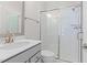 Modern bathroom with a glass-enclosed shower, gray vanity, and stylish fixtures at 1203 Corkery Ridge Ct, Cary, NC 27519
