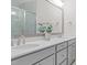 Beautiful bathroom featuring double sinks with white cabinets and marble backsplash at 1203 Corkery Ridge Ct, Cary, NC 27519