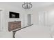 Light and bright primary bedroom with a dresser, and a wall-mounted television at 1203 Corkery Ridge Ct, Cary, NC 27519